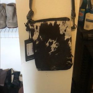Faux cow hide cross body bag